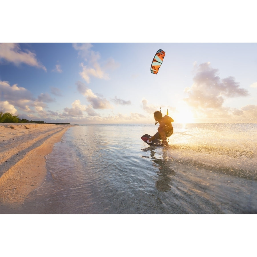 Kiteboarding in tropical lagoon in the South Pacific at sunset; Tikehau French Polynesia Poster Print (8 x 10) Image 1