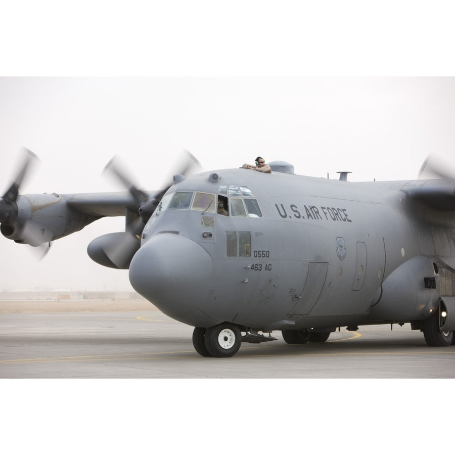 A C-130 Hercules aircraft taxis on the tarmac Poster Print (8 x 10) Image 1