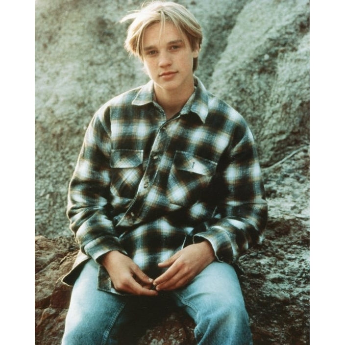 Devon Sawa Photo - Sitting on a rock ledge (8 x 10) - Item PIC478 Image 1