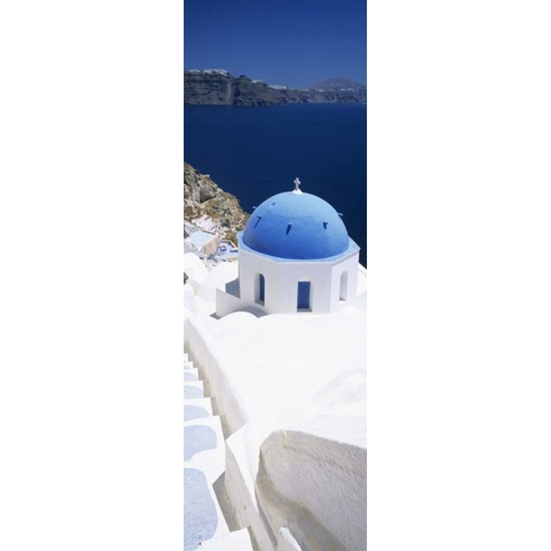 High angle view of a church with blue dome Oia Santorini Cyclades Islands Greece Poster Print (36 x 12) Image 1