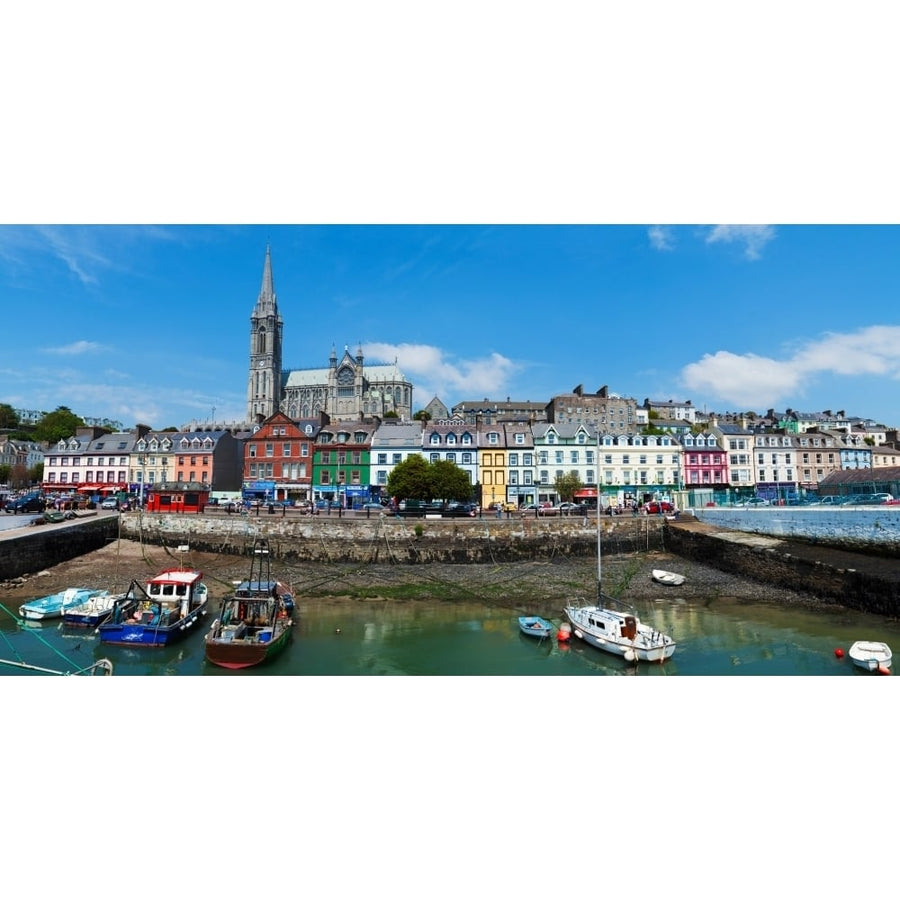 Fishing boats at a harbor with a cathedral in the background St Colmans Cathedral Cobh County Cork Republic Of 36 x 12 Image 1