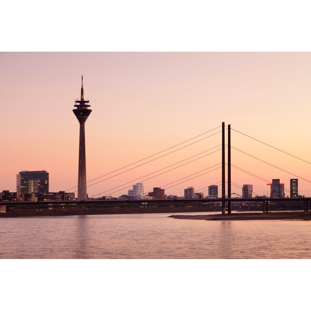 Silhouette of Rheinturm Tower and Rheinkniebrucke Bridge Dusseldorf North Rhine Westphalia Germany Poster (27 x 9) Image 1