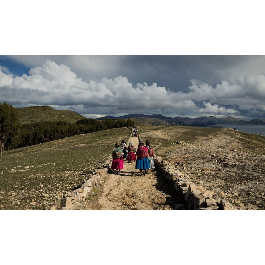 Bolivian women in traditional dress walking along the Inca Trail To Machu Image 1