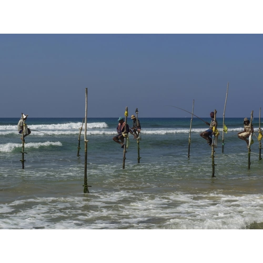 Stilt fishermen on beach Galle Southern Province Sri Lanka Poster Print (24 x 18) Image 1