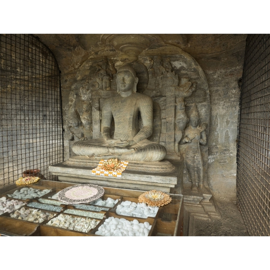 Seated Buddha figure called the Vidyhadhara Guha carved from single rock face at Image 1