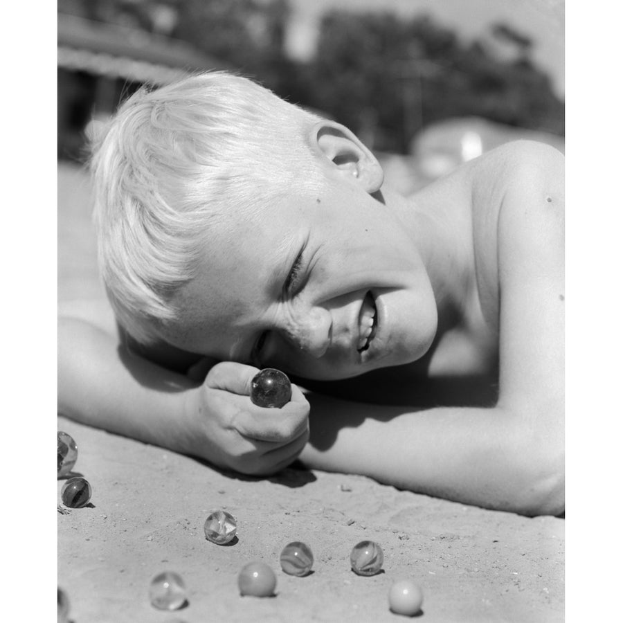 1950s Boy Crouching Shooting Marbles Concentration Poster Print By Vintage Collection (11 X 14) Image 1