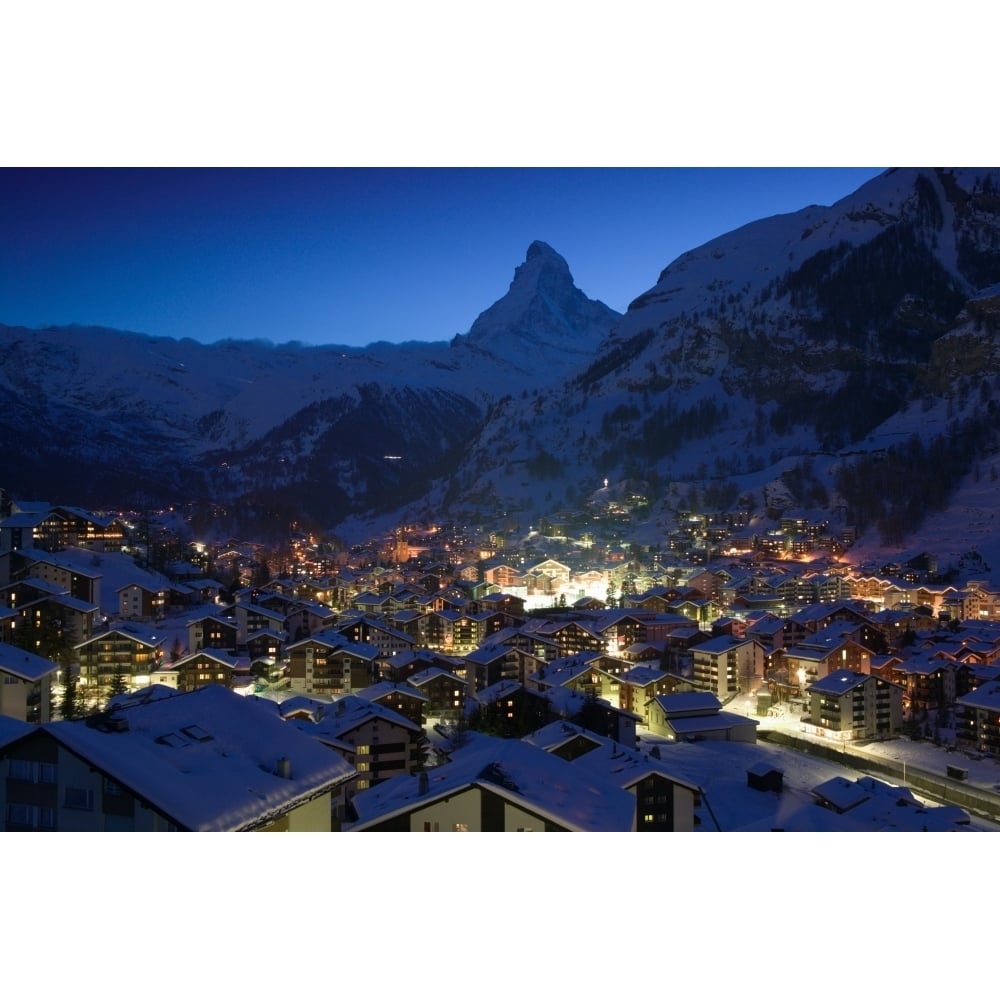 High angle view of buildings lit up at dusk Matterhorn Zermatt Switzerland Poster Print (36 x 12) Image 1