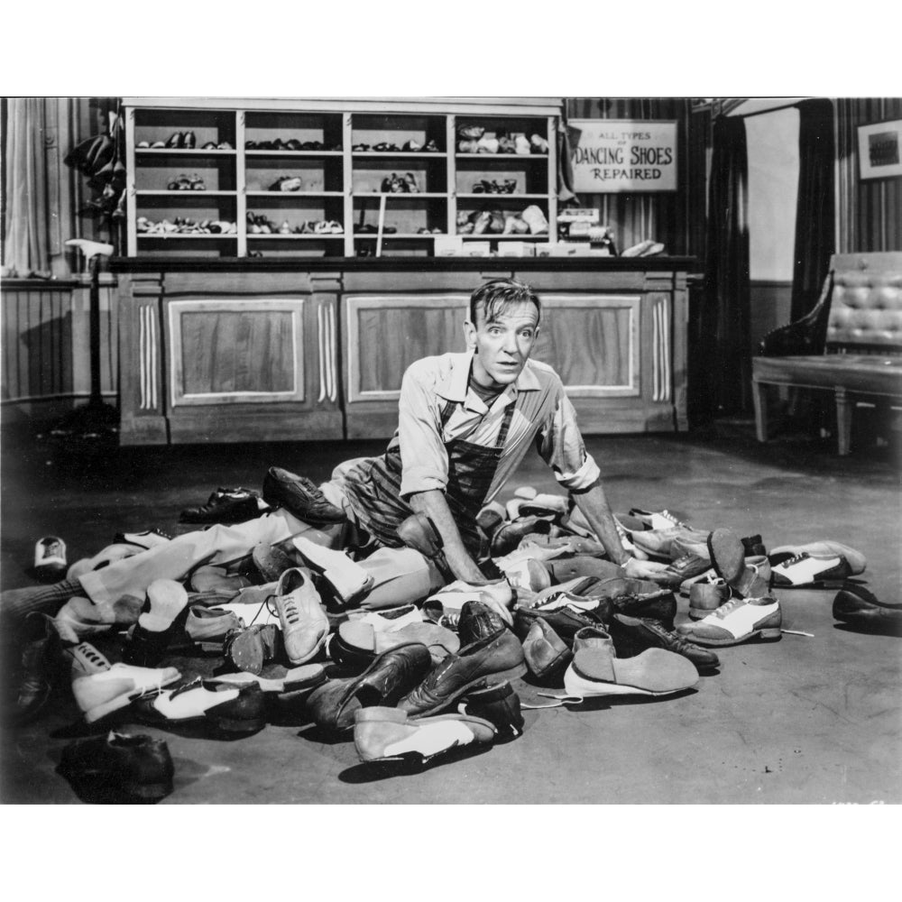 Film still of Fred Astaire sitting amongst shoes Photo Print Image 1