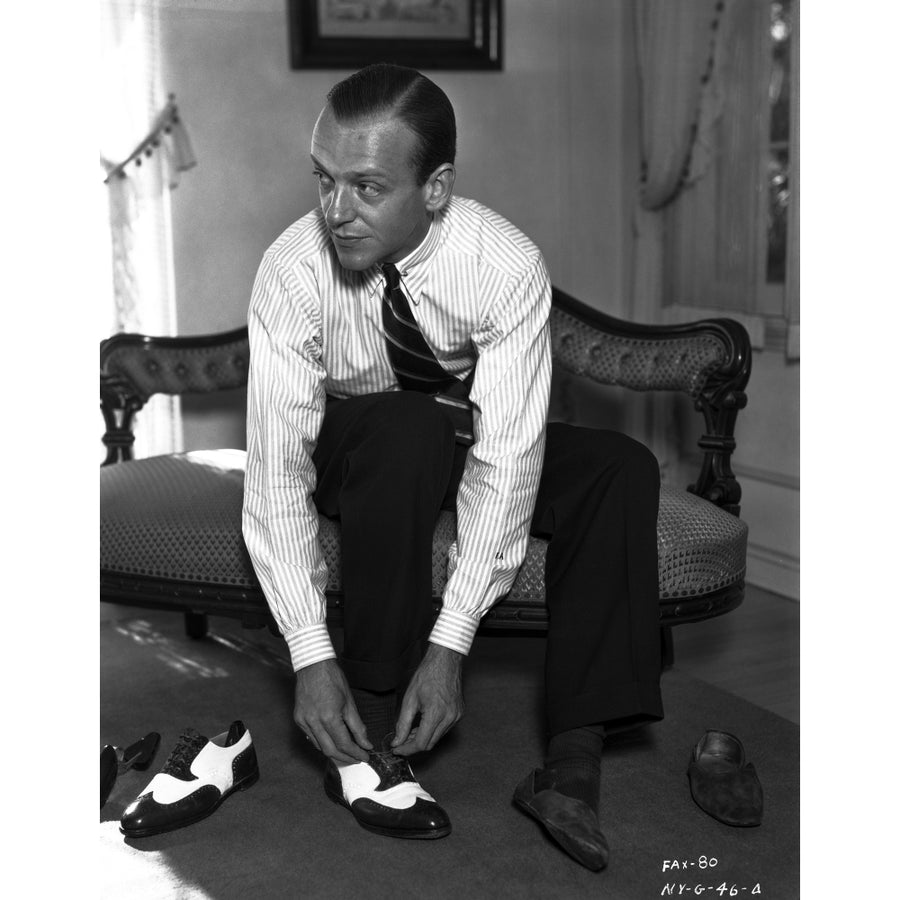 Fred Astaire Seated on Couch while wearing Shoe Photo Print Image 1