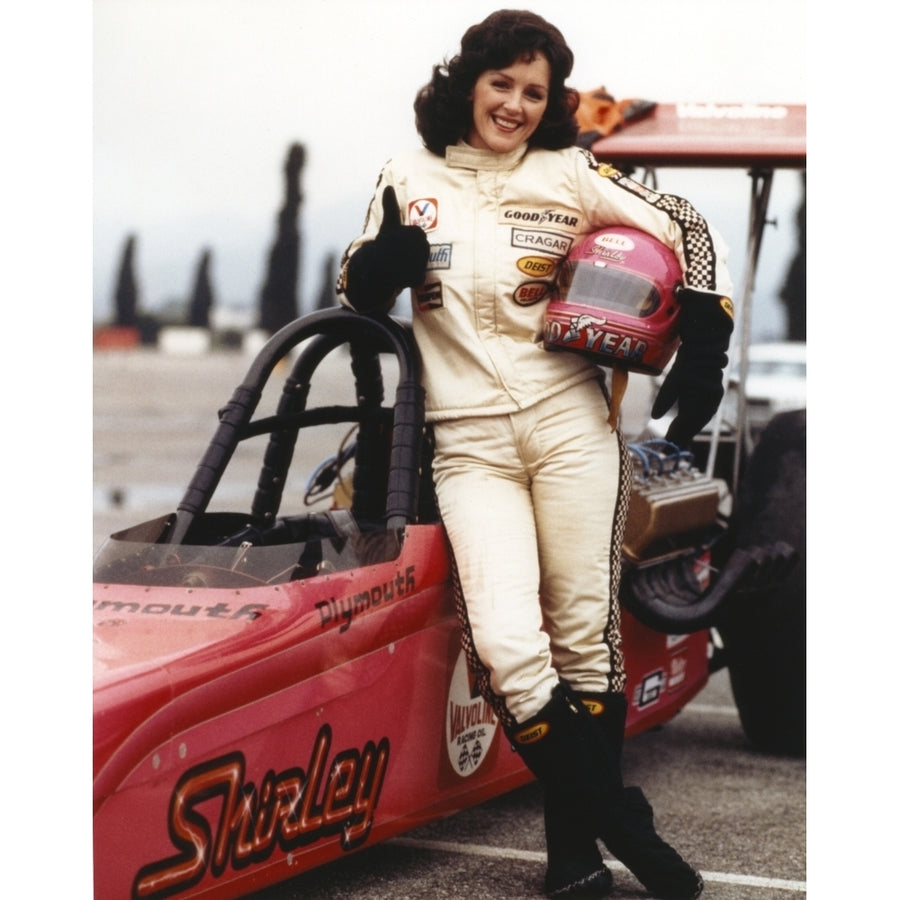 Bonnie Bedelia Posed in Car Racing Outfit Carrying Her Helmet Photo Print Image 1