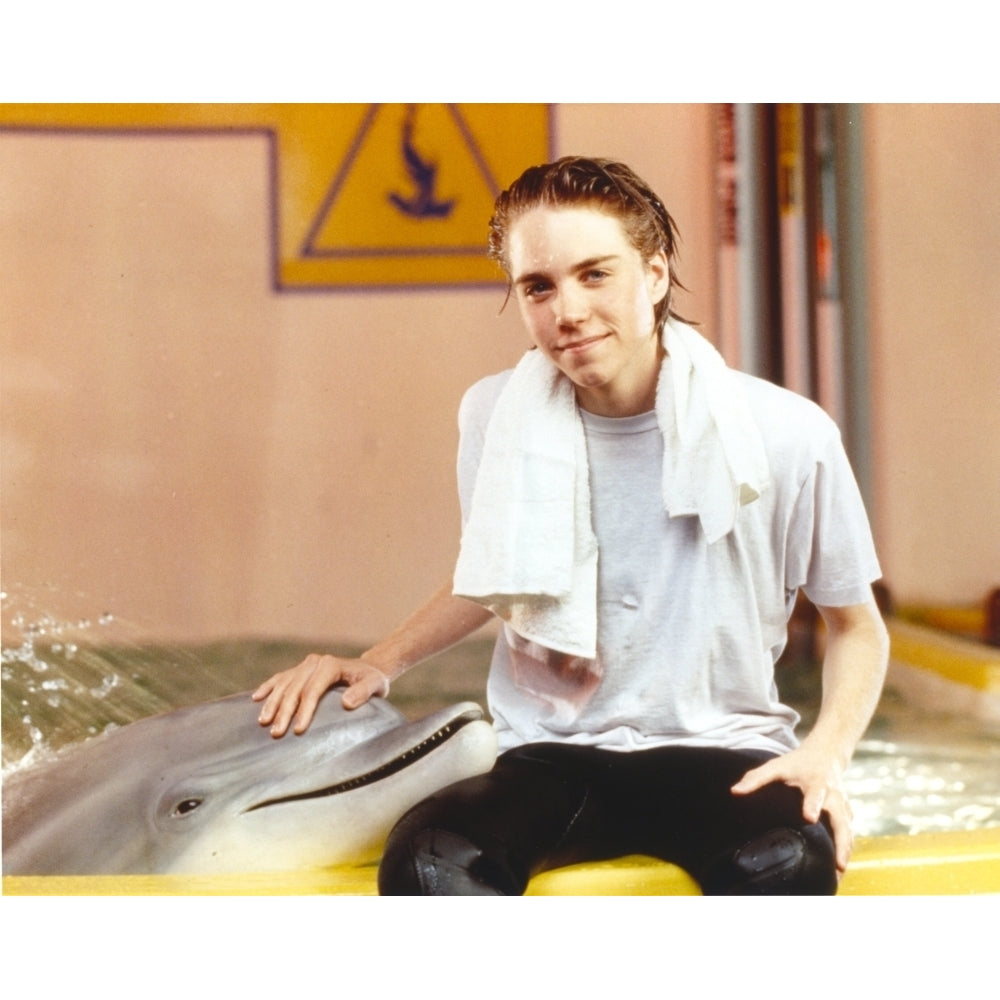 Jonathan Brandis posed with Dolphin Photo Print Image 1