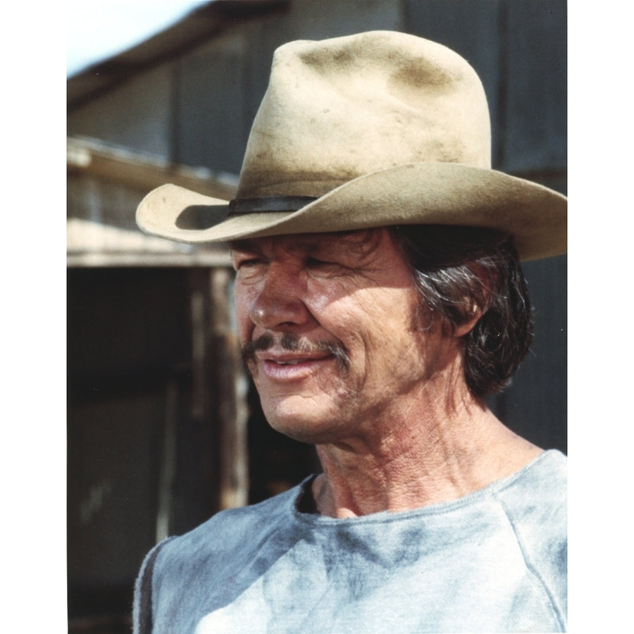 Charles Bronson smiling in Blue Shirt and Brown Hat Photo Print Image 1