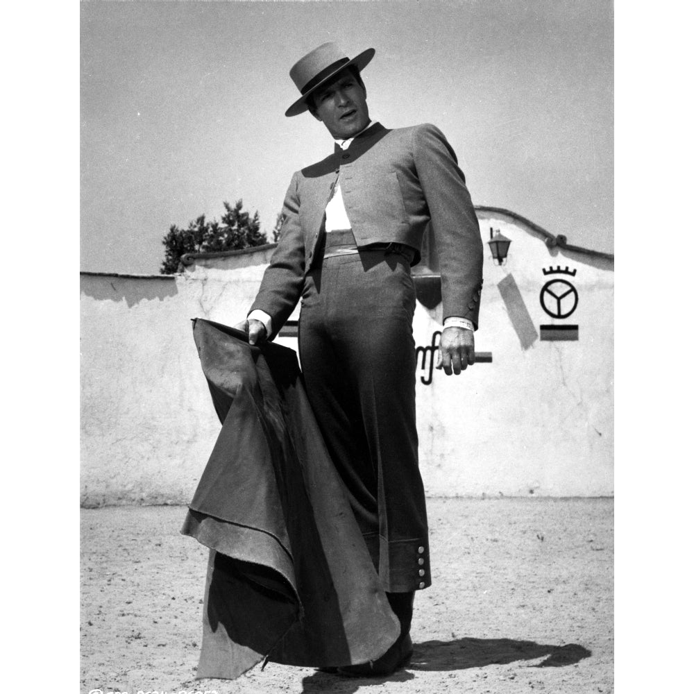 Film still of Hugh OBrian outdoors with a matadors cape Photo Print Image 1