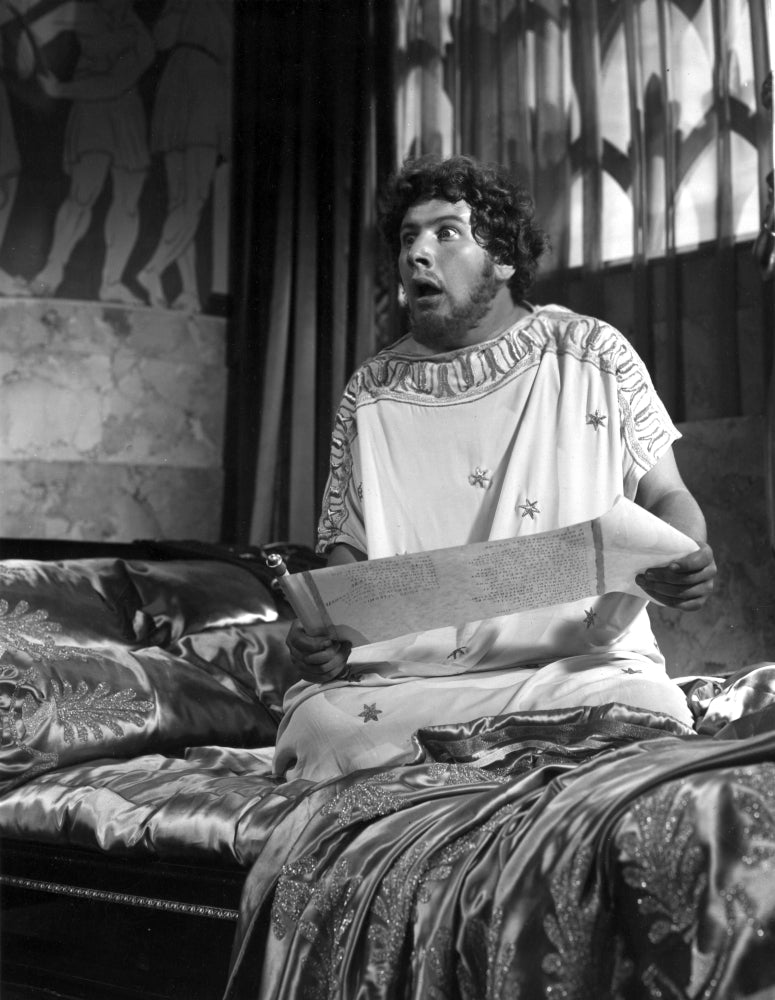 A film still of Peter Ustinov looking shocked in a historical costume Photo Print Image 1