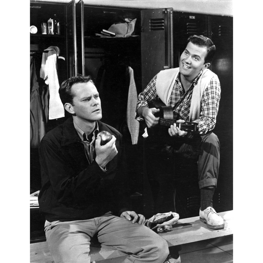 Film still of Pat Boone playing a guitar and a co star in a locker room Photo Print Image 1