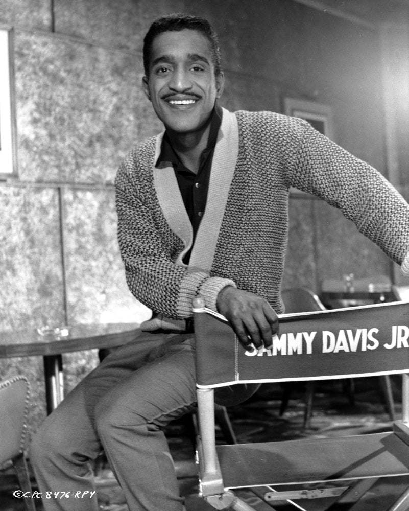 Sammy Davis Jr on a directors chair Photo Print Image 1