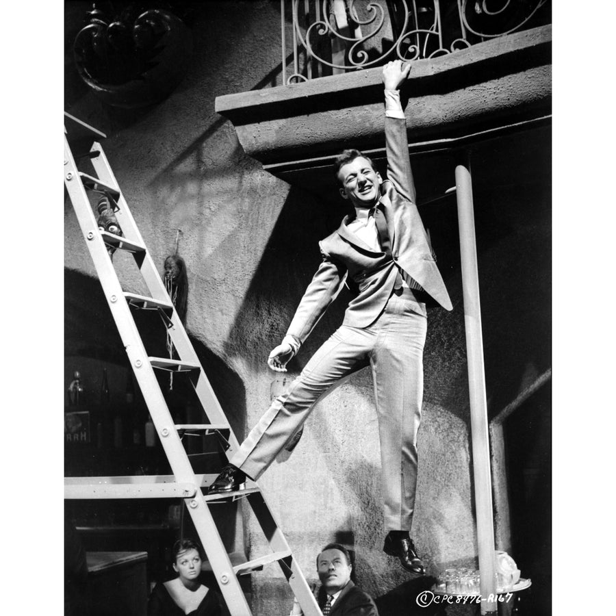 Bobby Darin hanging from a balcony Photo Print Image 1