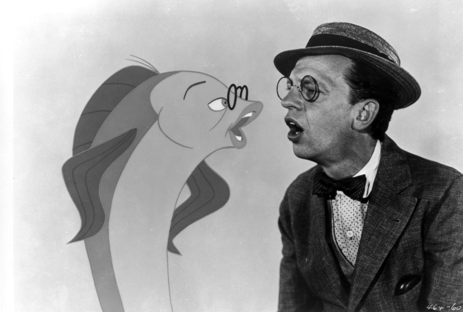 Film still of Don Knotts singing with a cartoon fish Photo Print Image 1