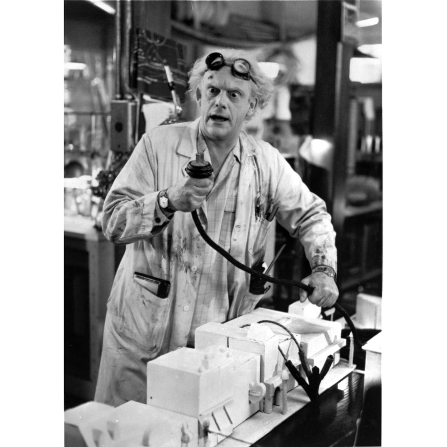 Film still of Christopher Lloyd wearing a lab coat Photo Print Image 1