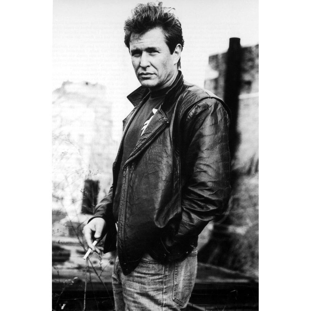 Film still of Tom Berenger wearing a leather jacket outdoors Photo Print Image 1