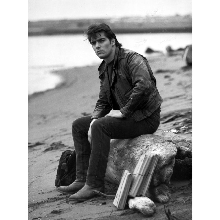 Ken Wahl on a rock at a beach Photo Print Image 1