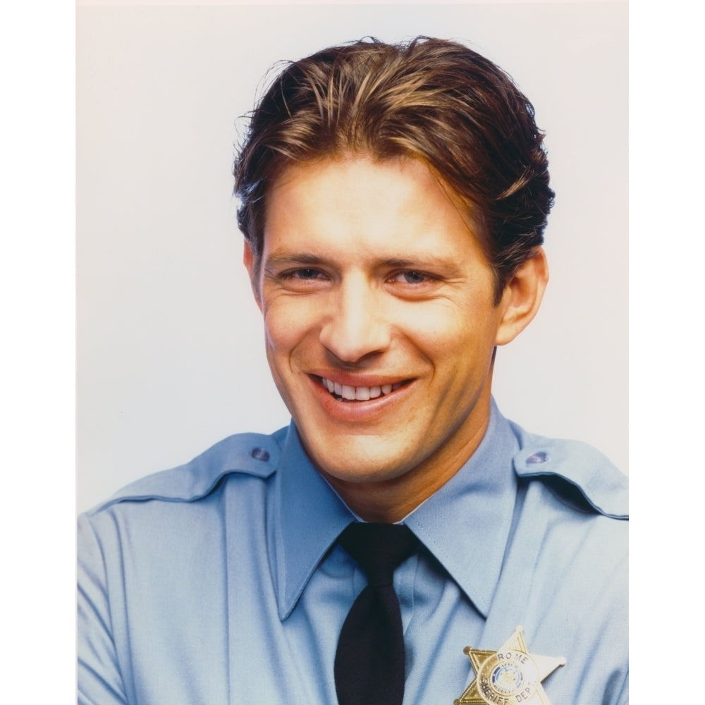 Costas Mandylor smiling in Police Outfit Photo Print Image 1