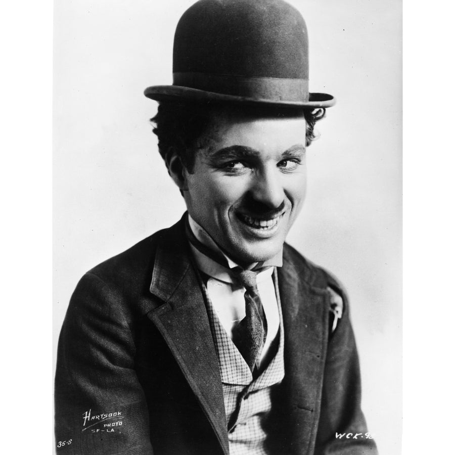 Charlie Chaplin smiling in a Coat and Tie Photo Print Image 1