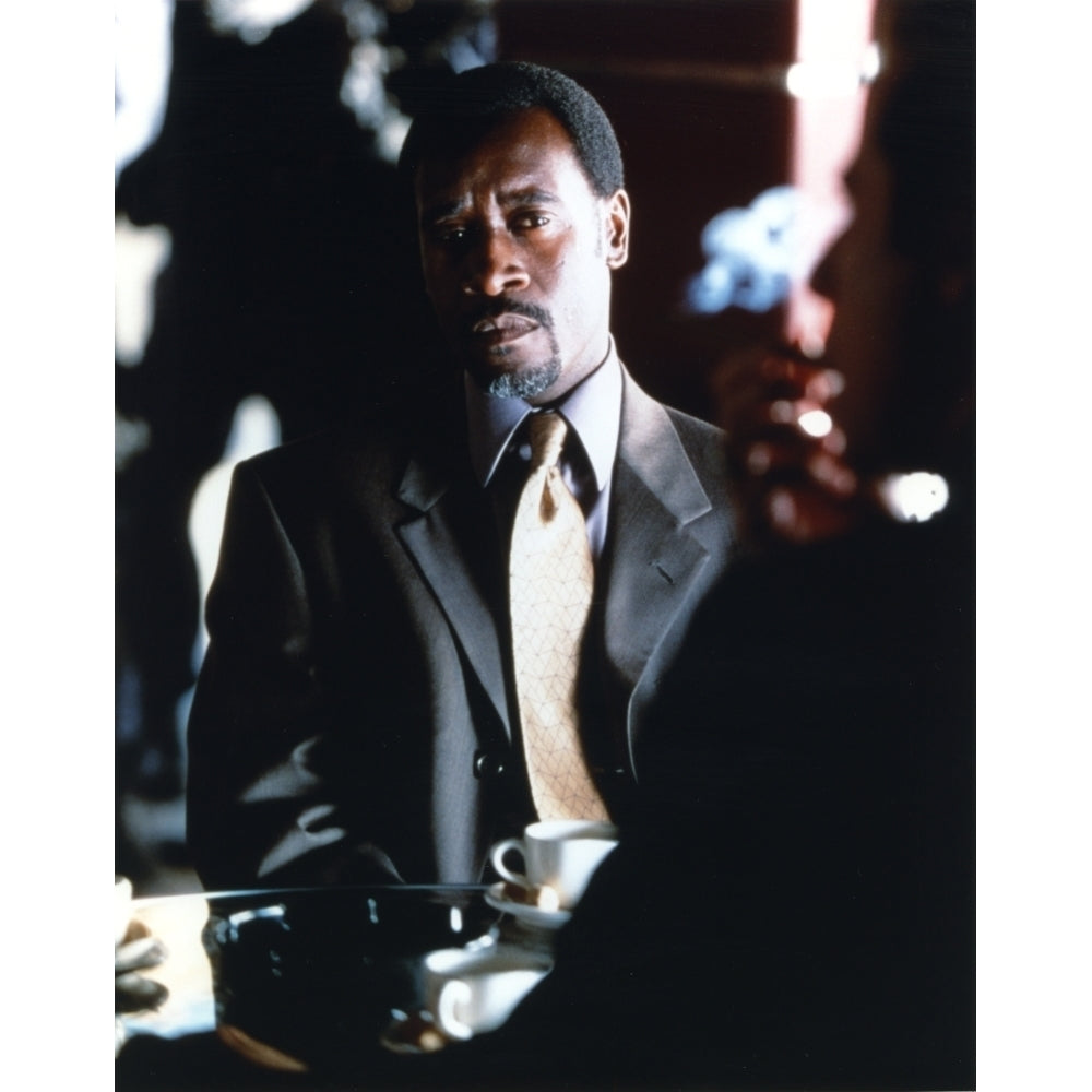 Don Cheadle sitting in Gray Coat Photo Print Image 1