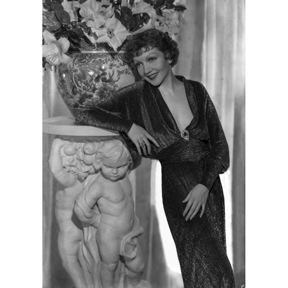 Claudette Colbert Leaning on Statue wearing Black Dress Photo Print Image 1