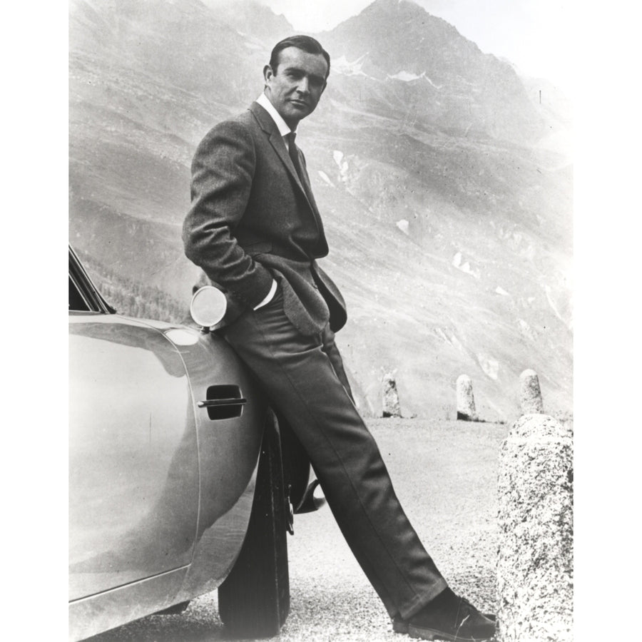 Sean Connery leaning on a car in Goldfinger Photo Print Image 1