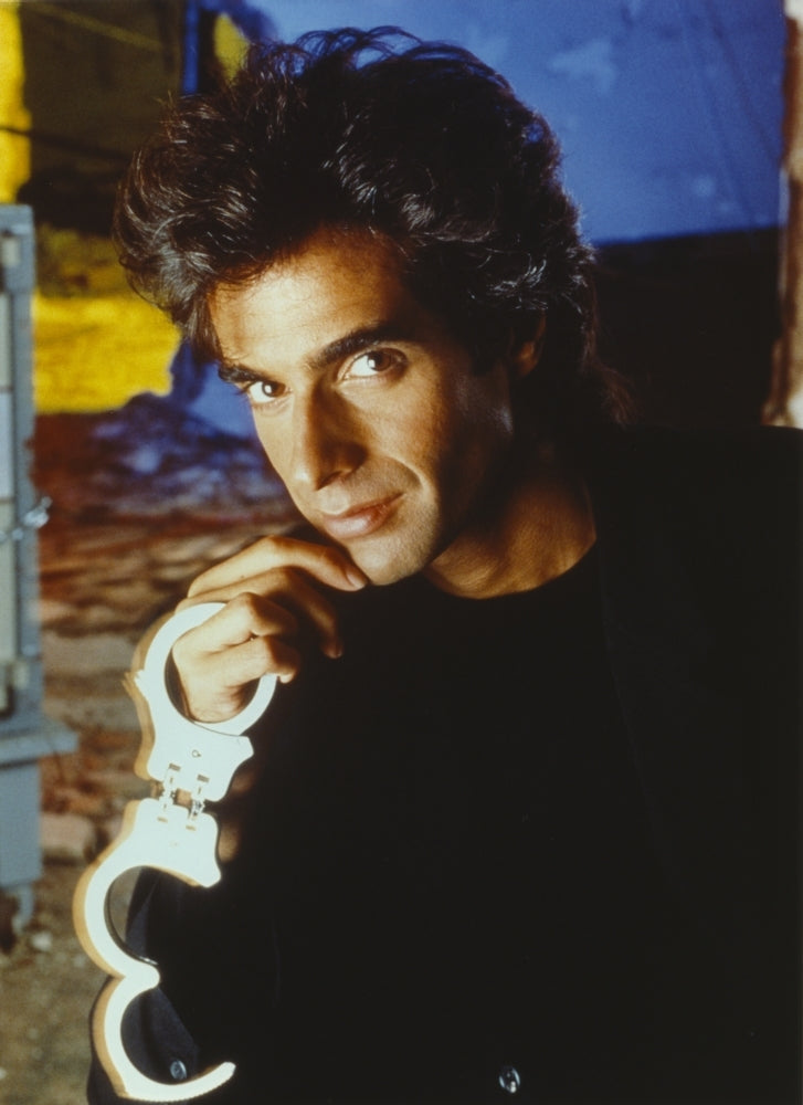 David Copperfield Holding Handcuffs in Black Shirt Photo Print Image 1