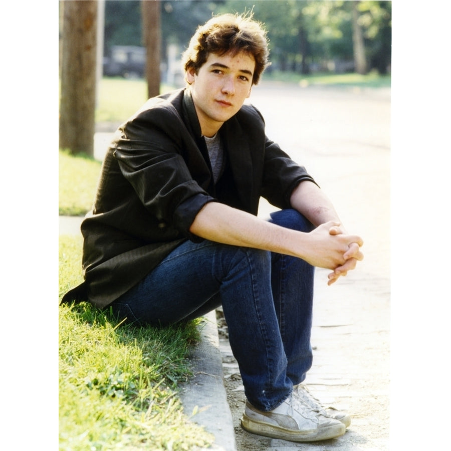 John Cusack sitting on the Side Walk Photo Print Image 1