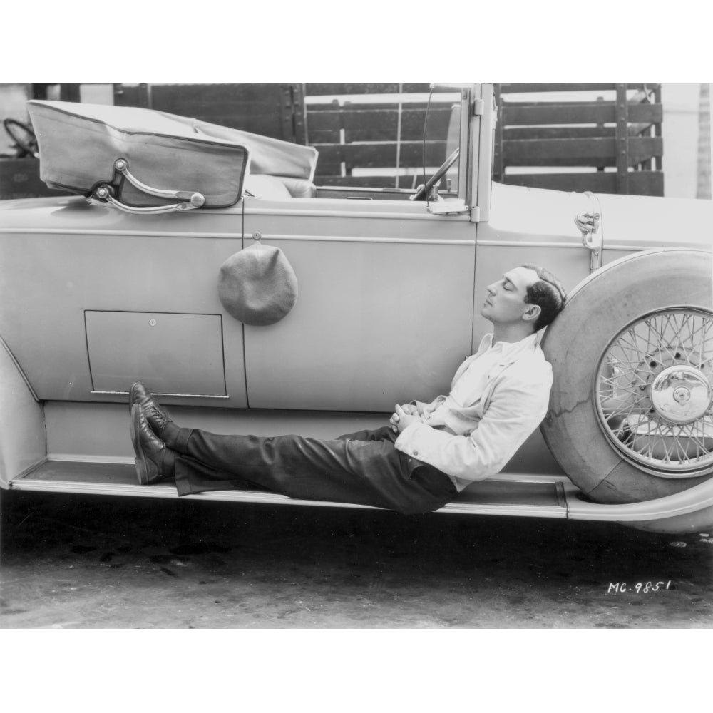 Buster Keaton sleeping on a car Photo Print Image 1