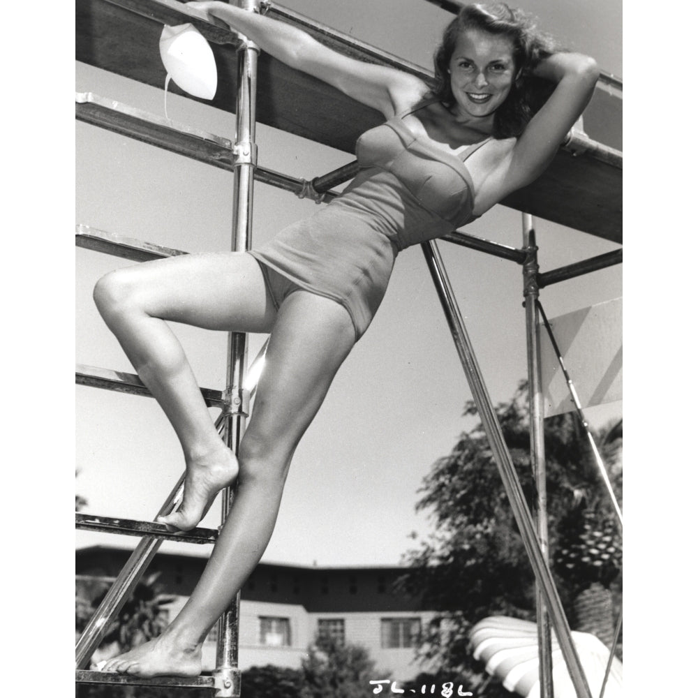 Janet Leigh Posed on the Steel Ladder in Grey Silk One Piece Swimsuit while Left Hand Behind the Head Photo Print Image 1