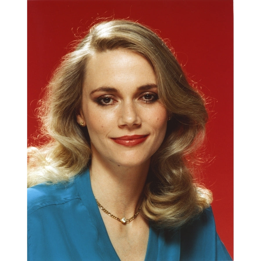 Peggy Lipton smiling in Blue Dress Portrait with Red Background Photo Print Image 1