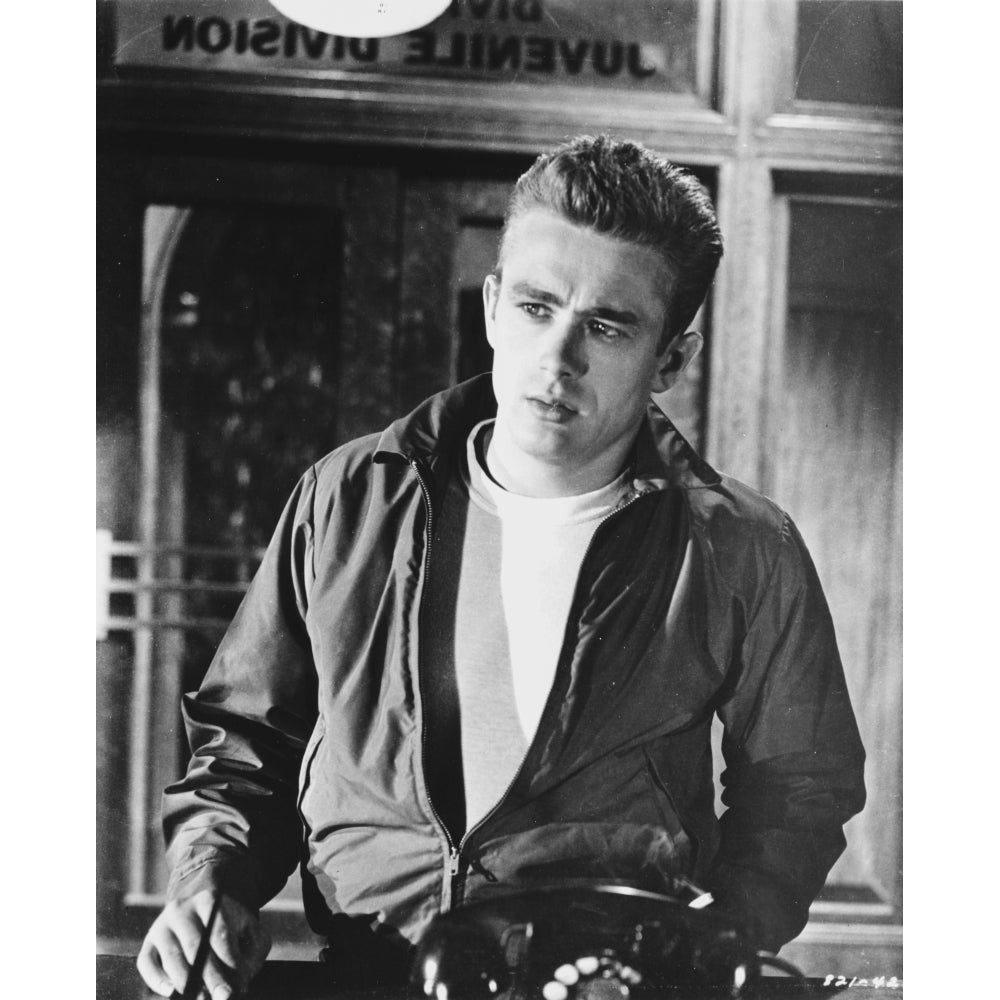 James Dean Posed in Black Long Sleeve Silk Jacket and White Round Neck T-Shirt with Left Hand on the Waist and Eyes Image 1