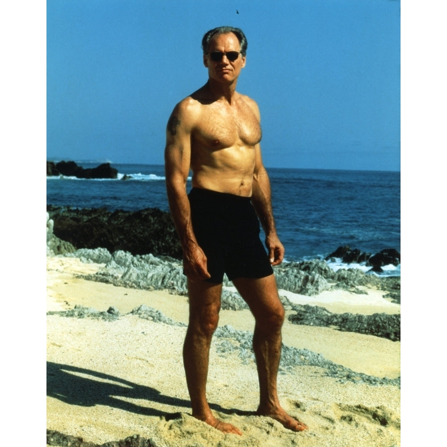 Fred Dryer standing on Sand in Swimming Trunks Photo Print Image 1