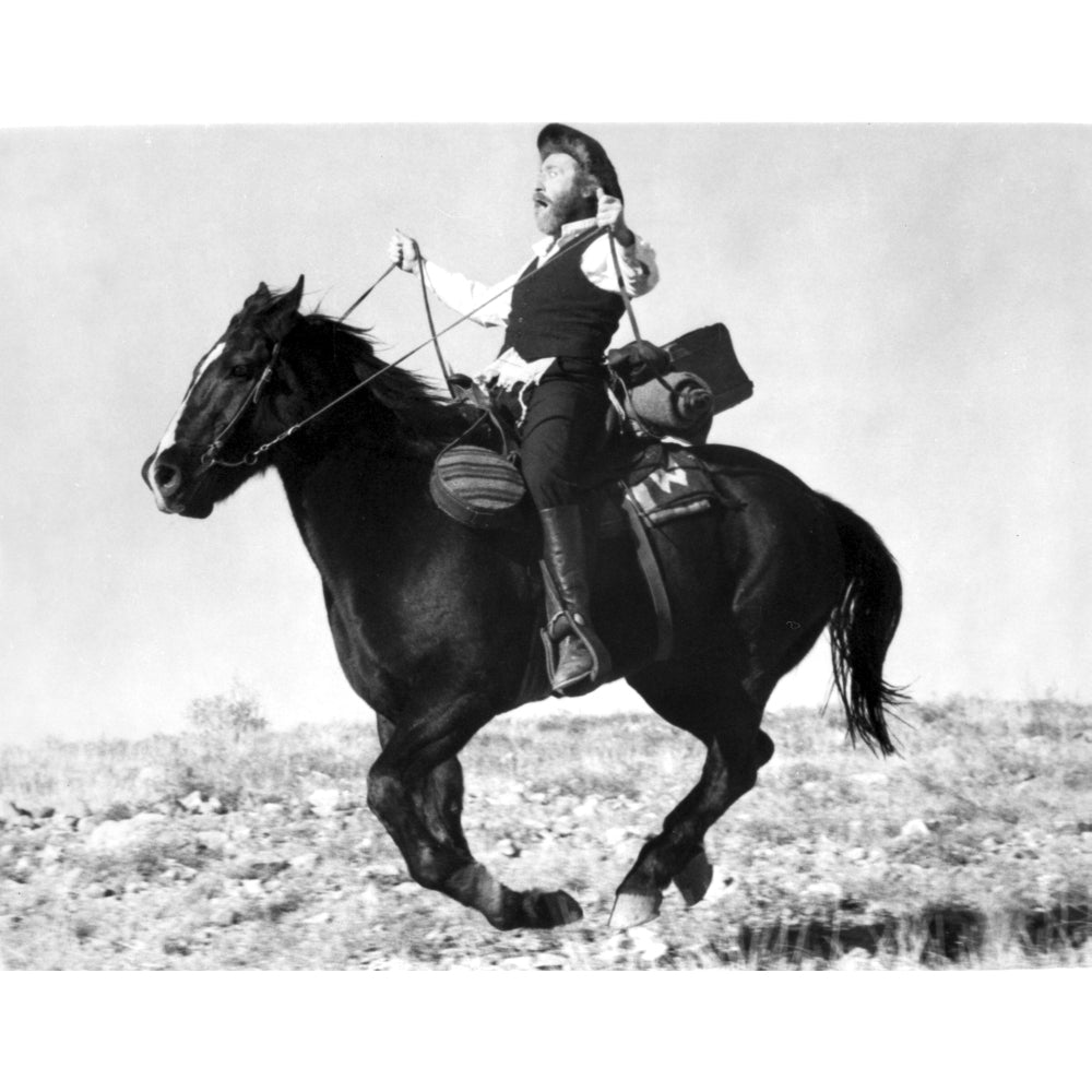 A film still of Gene Wilder riding a horse Photo Print Image 1