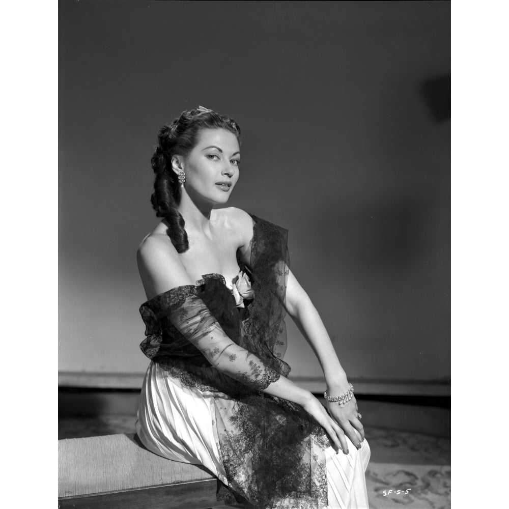 Yvonne Decarlo sitting in Black Strapless Dress with Net Dress Photo Print Image 1