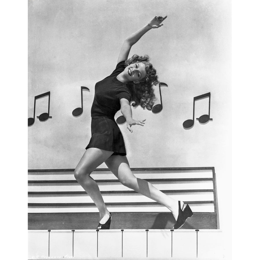 Rita Hayworth Dancing Pose with a Musical Notes Background Photo Print Image 1