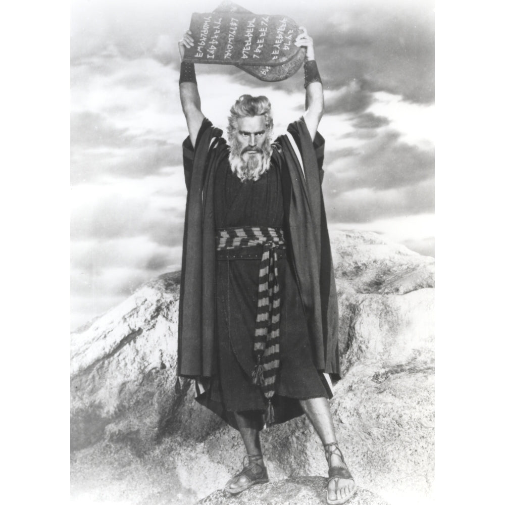 Charlton Heston Raising the Ten Commandments wearing Red Dress with Slippers - A film still from The Ten Commandments Image 1