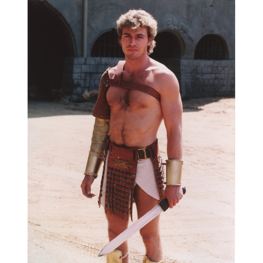 Jon-Erik Hexum wearing a Gladiator Costume with a Blade in a Close Up Portrait Photo Print Image 1