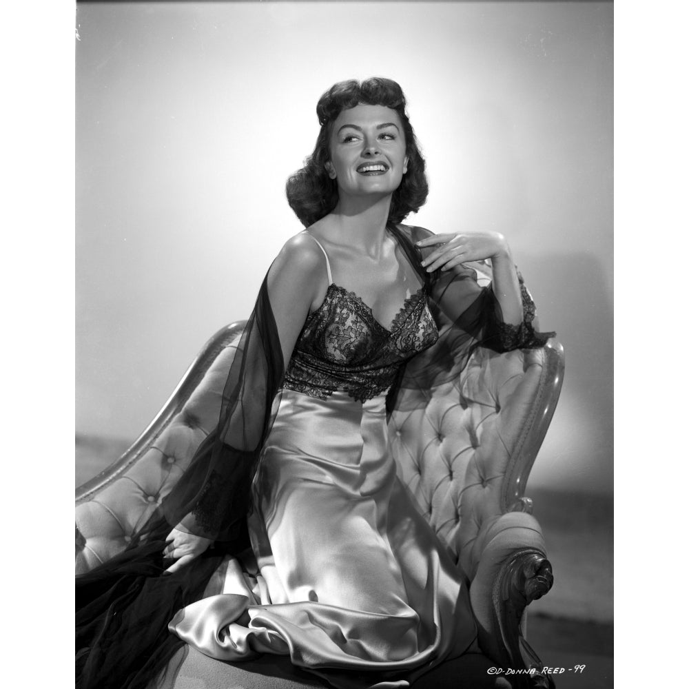 Donna Reed on a Dress Kneeling on Couch Photo Print Image 1