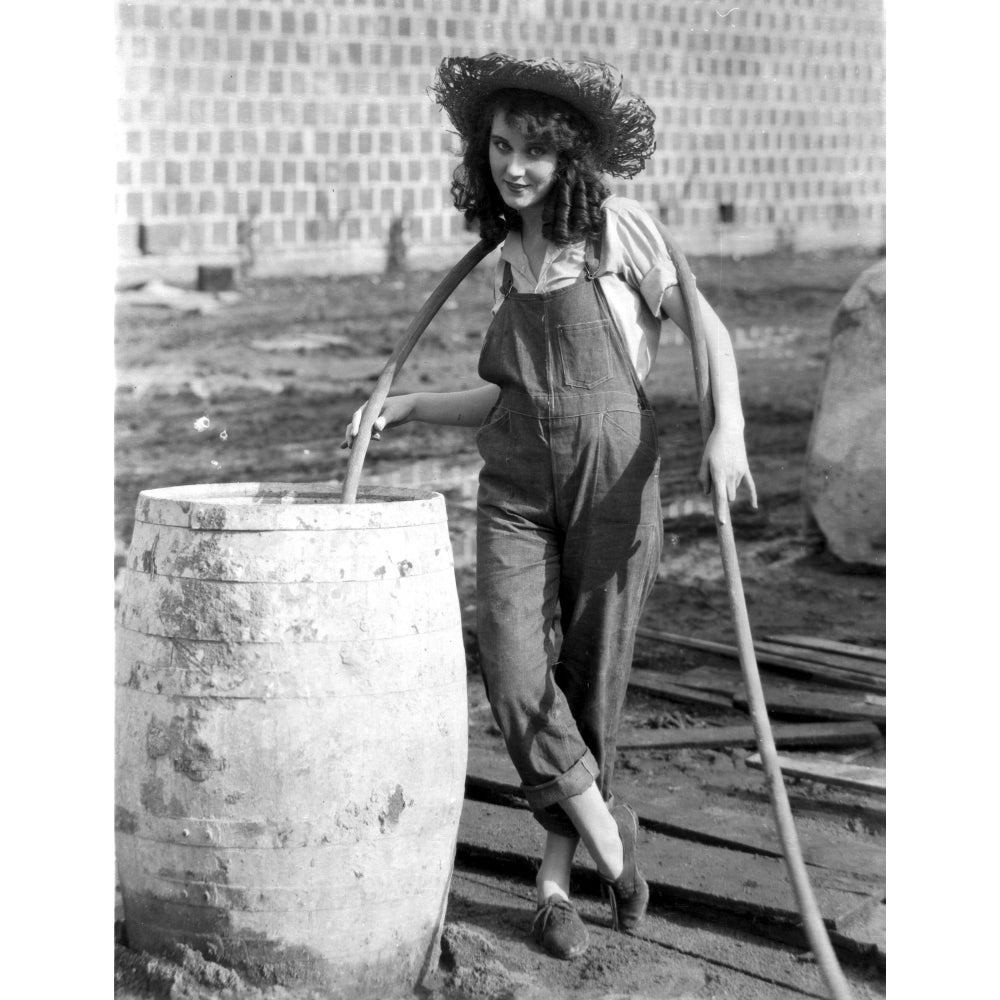 Fay Wray Filling Up Drum with Water in Jumper Photo Print Image 1