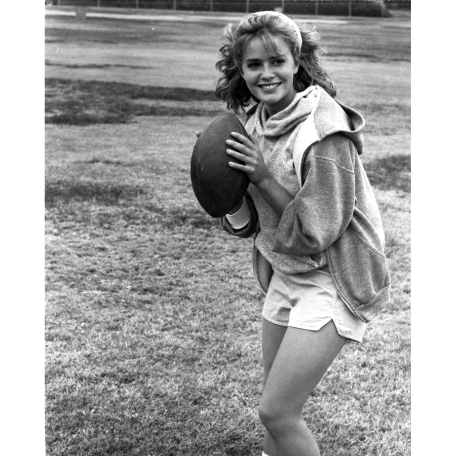 Elizabeth Shue Holding Football in Classic Photo Print Image 1