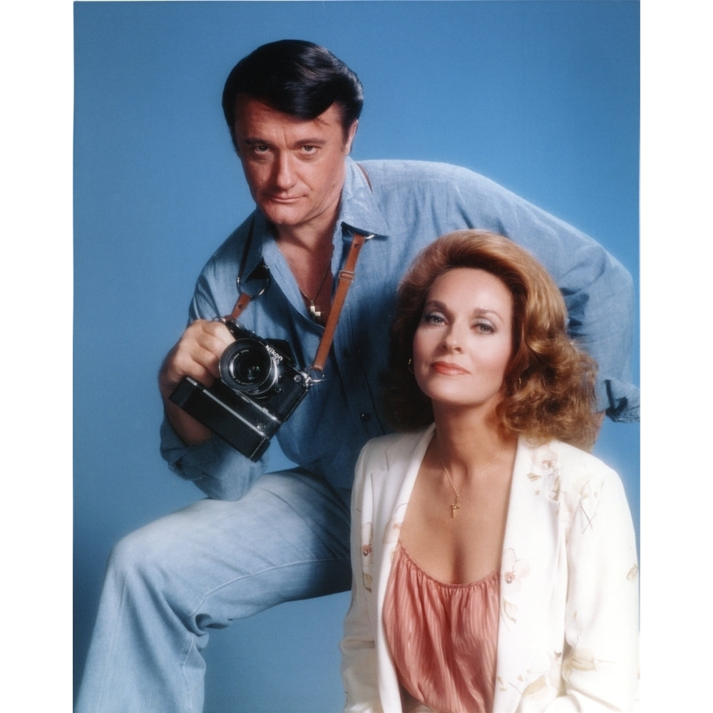 Robert Vaughn Holding a Camera in Blue Background Photo Print Image 1