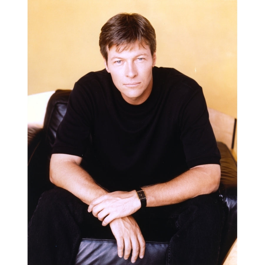 Jack Wagner sitting on a Couch in Black Shirt Photo Print Image 1