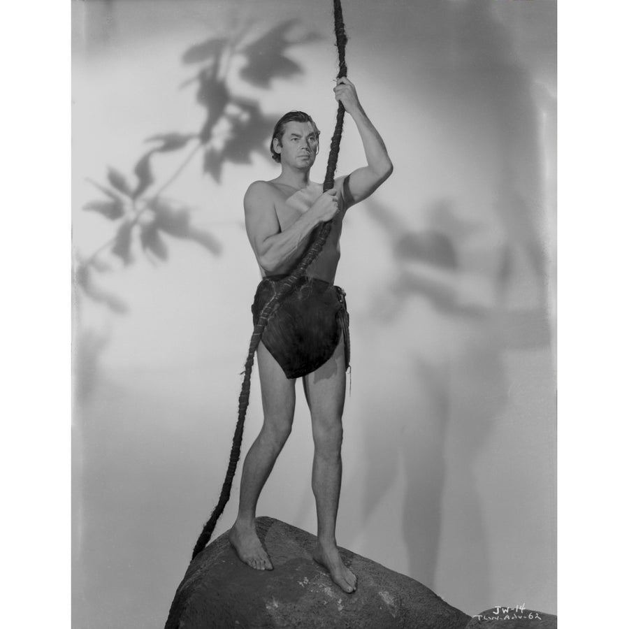 Johnny Weissmuller Holding on a Rope Swing in a Classic Movie Scene Photo Print Image 1