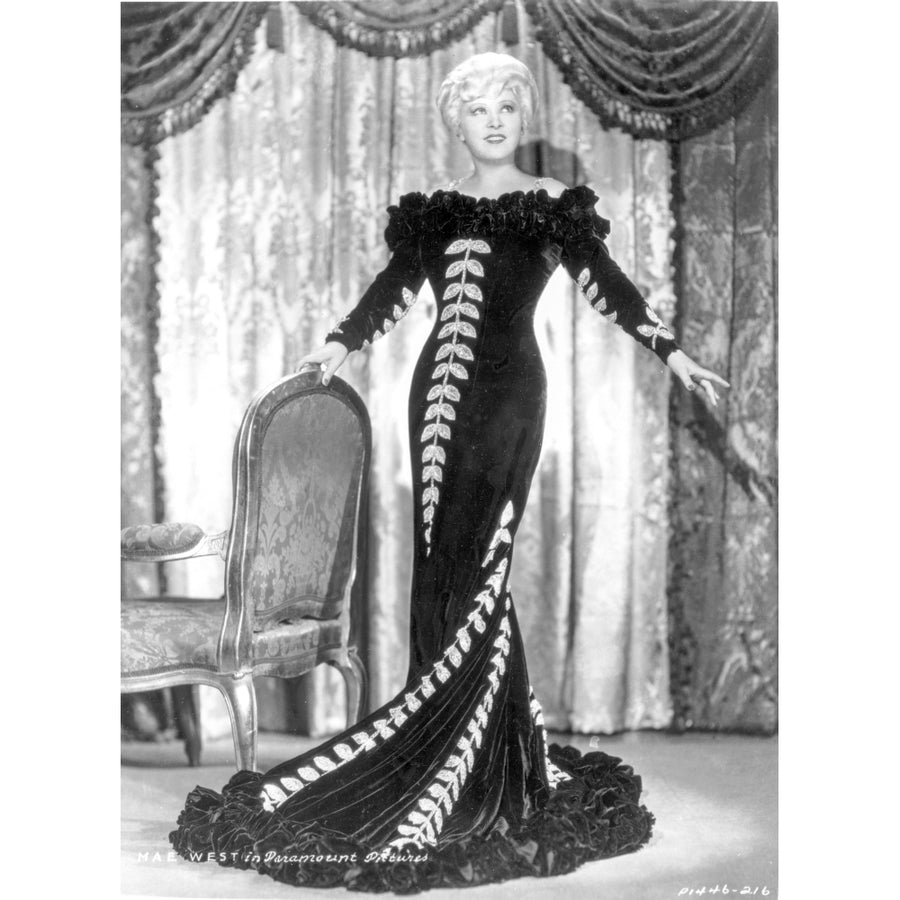 Mae West standing in Black Long Gown with Arms Open Photo Print Image 1