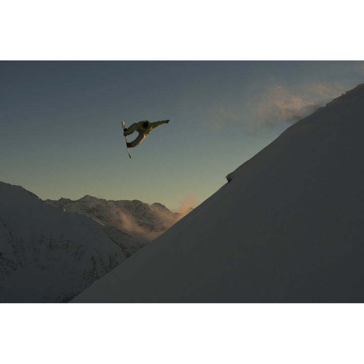 Professional snowboarder Frederik Kalbermatten extreme snowboarding at sunset Arlberg Austria Poster Print Image 2